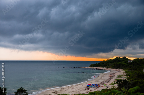 Thunderheads in August over the ocean off Fishers Island in Long Island Sound at dusk photo