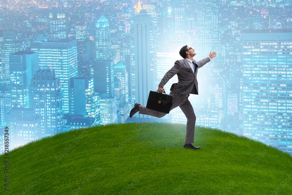 Happy businessman running towards his goal Happy businessman running towards his goal