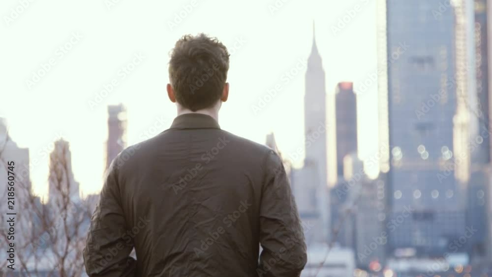 Person's outline with New York skyline in the background. Person's outline with New York skyline in the background.