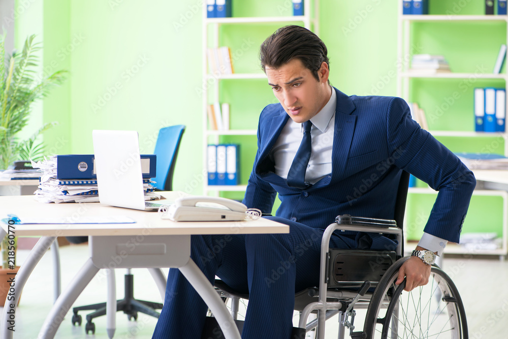 Disabled businessman working in the office Disabled businessman working in the office