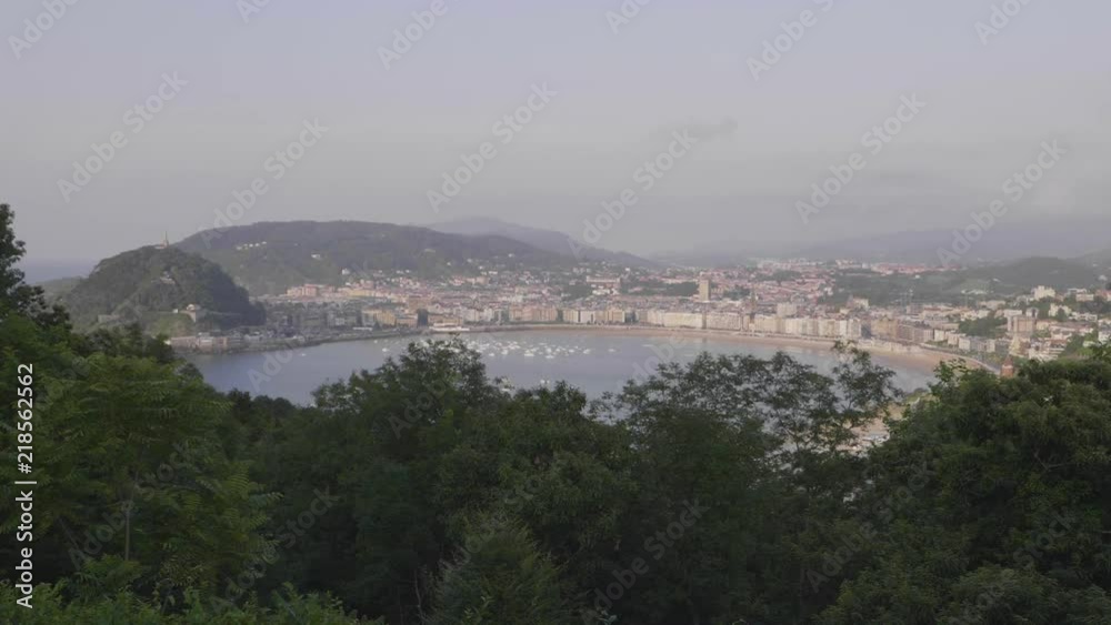 Panoramic view of San Sebastians bay in the evening from elevated viewpoint. Slow Motion.