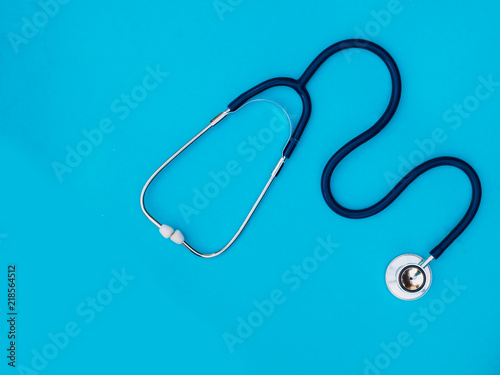 stethoscope on blue background copy space