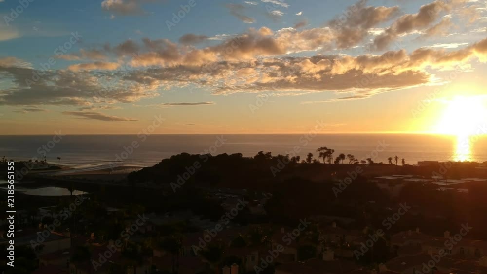 Rising DJI drone shot of the beautiful town of Solana Beach, San Diego overlooking an ocean sunset. Rising DJI drone shot of the beautiful town of Solana Beach, San Diego overlooking an ocean sunset.