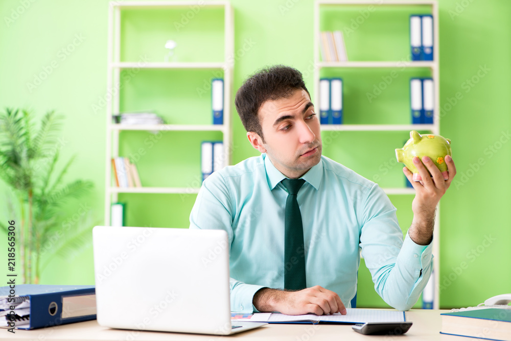 Fototapeta premium Male financial manager working in the office 