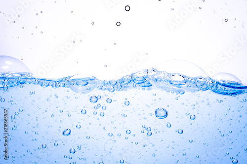 blue water surface with bubbles and splashes isolated on white background.