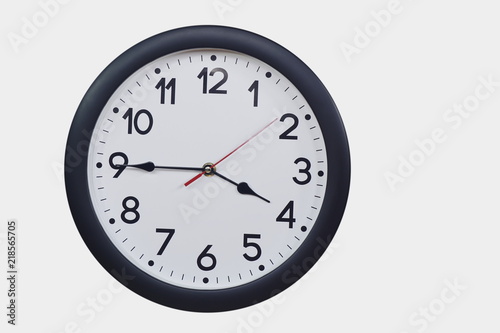 Time concept with black clock at a quarter to four am or pm