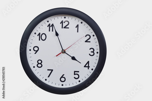 Time concept with black clock at three to four am or pm