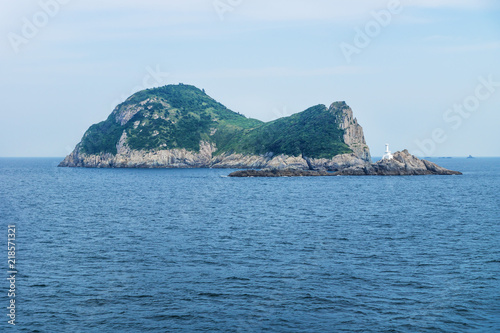 Island Hoenggando-gil with white lighthouse seen from ferry from Jeju to Mokpo, South Korea © Loes Kieboom