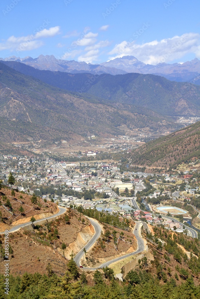 Winding or curved asphalt road on the hill with view of Thimphu city,  Bhutan