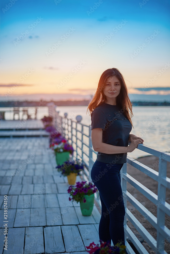 Cute girl standing near the river