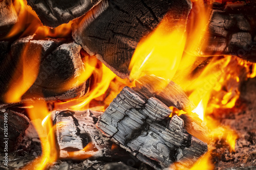 Coals in a hot fire close up.