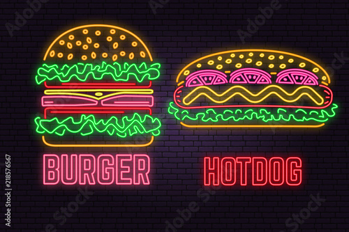Retro neon burger and hotdog sign on brick wall background. Design for fast food cafe.