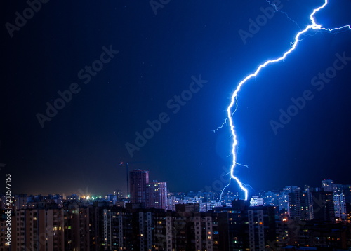 Lightning strike in the city Kyiv.. Storm outside. Thunderstorm with lightning in the city. Moment lightning