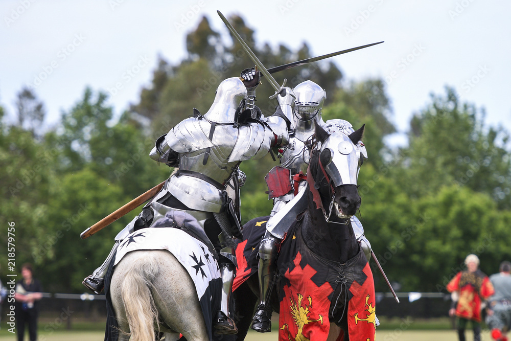 Fototapeta premium Two medieval knights confront during jousting tournament