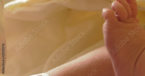 Little neonatal incubator, intensive hospital therapy: ICU, CCU, ICU, ITU. Tiny baby, small child, moving hands and fingers. Panning camera, Pan, Closeup photo