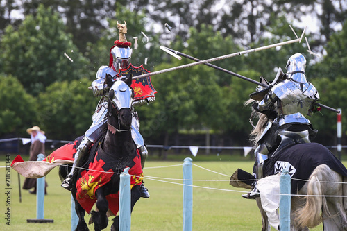 Two medieval knights confront during jousting tournament