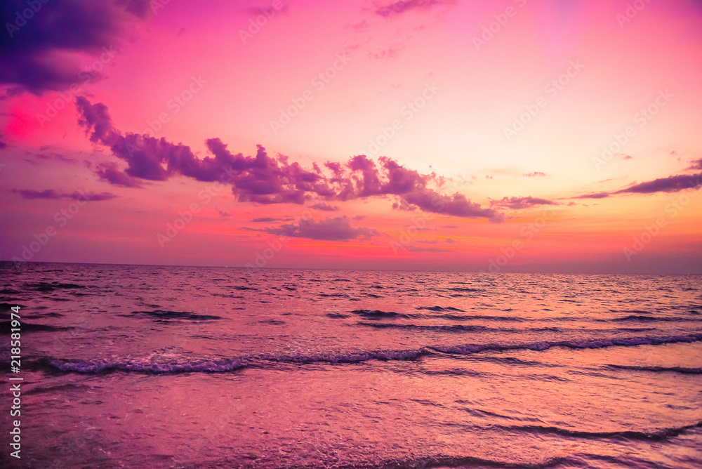 Nature in twilight period which including of sunrise over the sea and the nice beach. Summer beach with blue water and purple sky at the sunset.