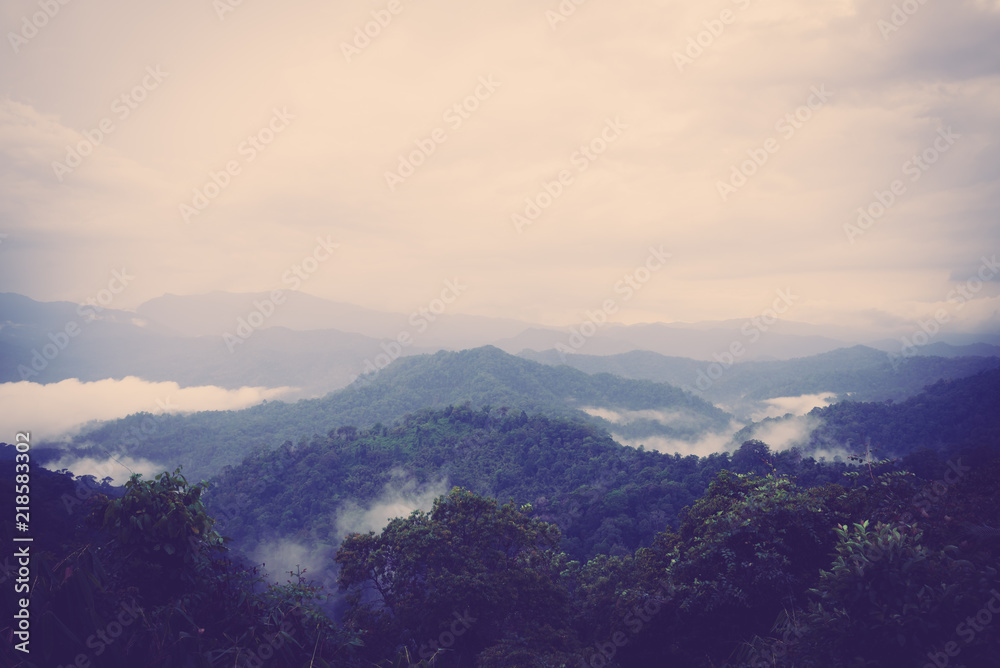 Scenic view of sunrise mountains at northeast Thailand, Mountain range for climbing in mountain trails. the landscape of mountain which including of copy-space for texting. - Vintage retro tone. Scenic view of sunrise mountains at northeast Thailand, Mountain range for climbing in mountain trails. the landscape of mountain which including of copy-space for texting. - Vintage retro tone.
