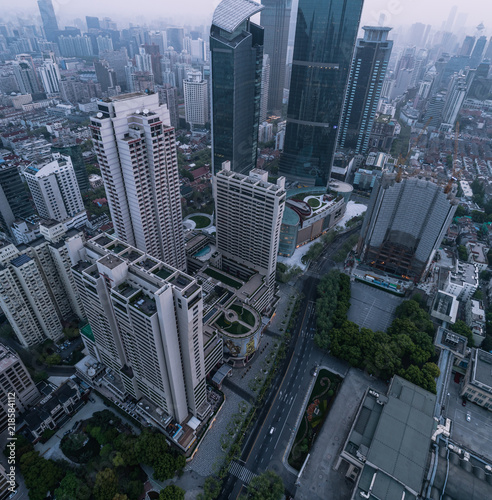 Aerial View of business area and cityscape in foggy dawn, West Nanjing road, Jing`an district, Shanghai © Bob