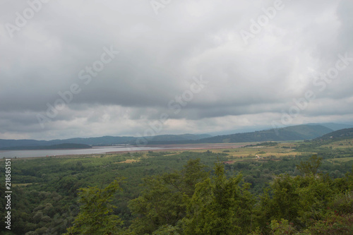 Mountains, forest and lake in the valley. Beautiful natural vacation © Khatuna