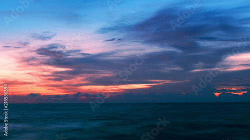 dramatic sky over sea in sunset evening time.