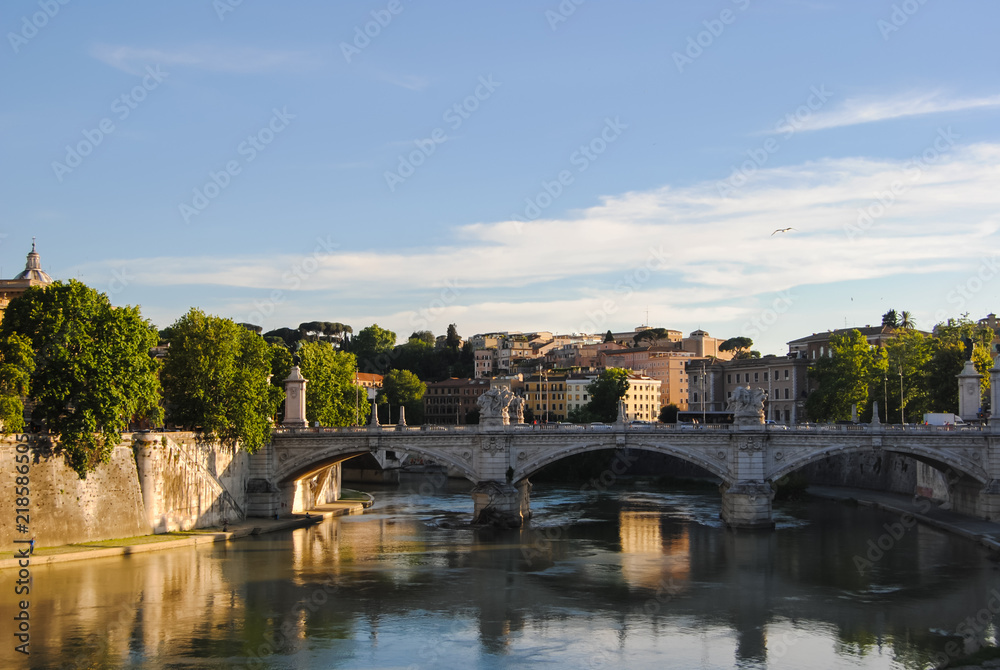 The view of Ponte Vittorio Emanuele - the bridge across the Tiber river near Vatican City, shot during the golden hour. 
