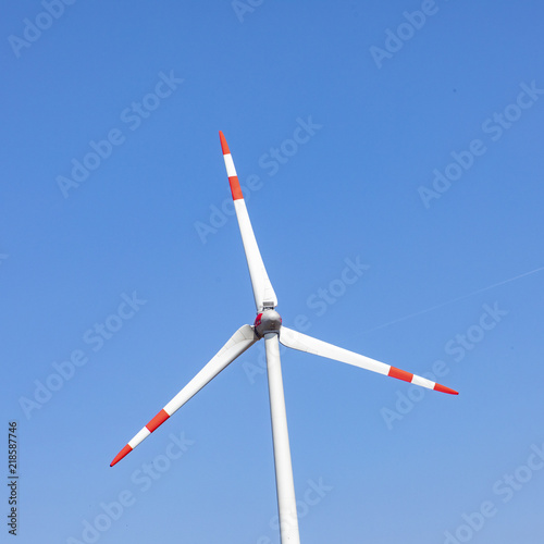 wind turbine under blue sky