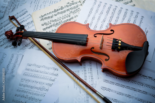 the violin lies on scattered notes