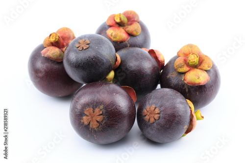Fresh mangosteens on white background, isolated. Mangosteen, queen of fruits. Tropical fresh fruit.
