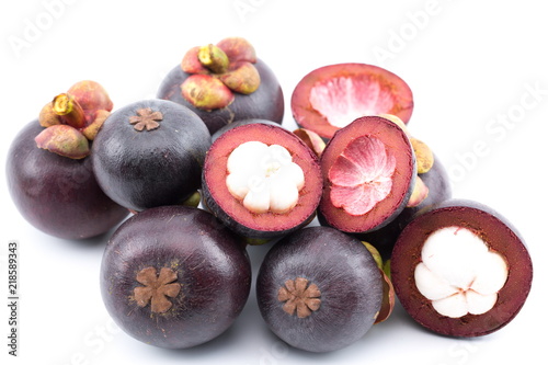 Fresh mangosteens on white background, isolated. Mangosteen, queen of fruits. Tropical fresh fruit.