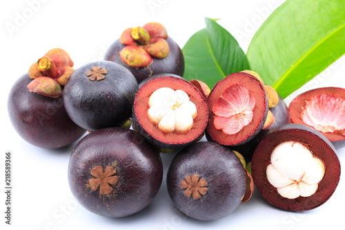 Fresh mangosteens on white background, isolated. Mangosteen, queen of fruits. Tropical fresh fruit.