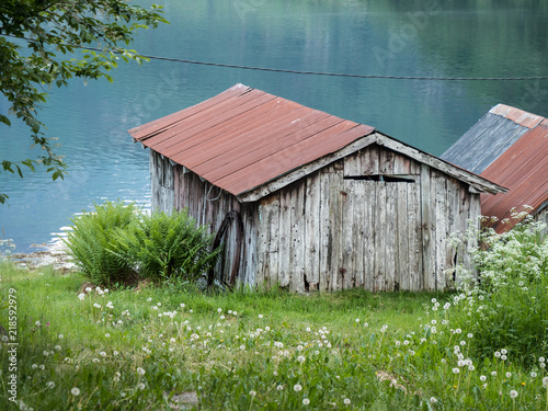 Canvastavla Old boathouses by Norwegian fjord
