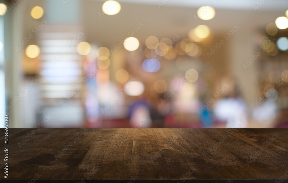 Empty wood table top and blur of night market background/selective focus .For montage product display. Empty wood table top and blur of night market background/selective focus .For montage product display.
