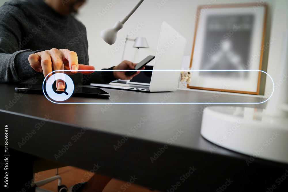 businessman working with smart phone and digital tablet and laptop computer in modern office