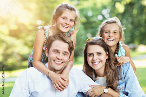 Young family with children having fun in nature