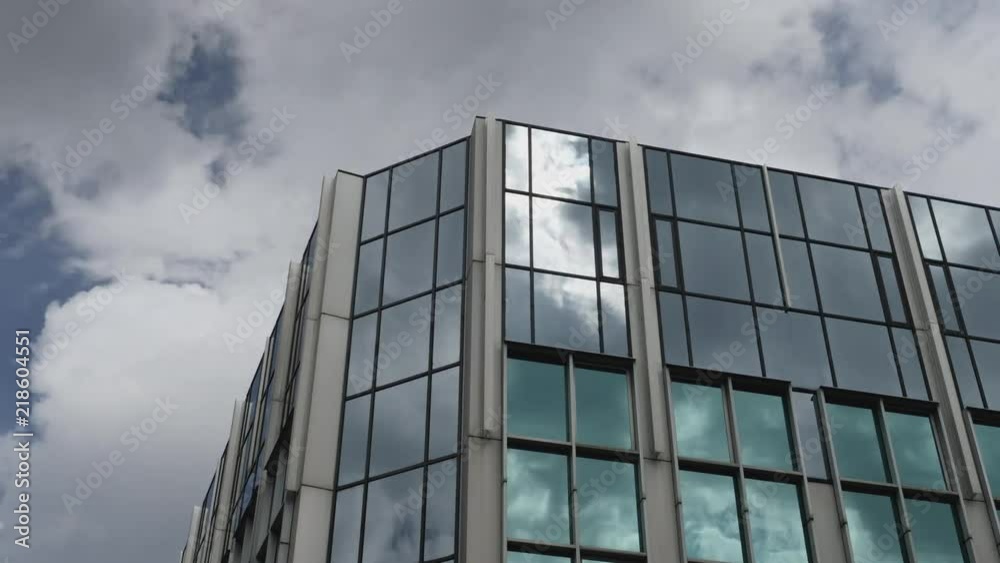 A daytime summer timelapse view of clouds passing by a reflective modern Pittsburgh building. A daytime summer timelapse view of clouds passing by a reflective modern Pittsburgh building.