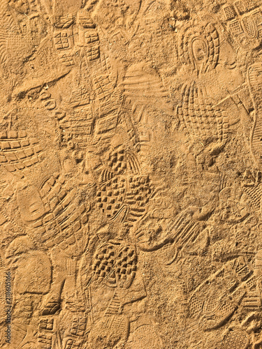 Fototapeta Naklejka Na Ścianę i Meble -  Many footprint on the sand beach texture background.