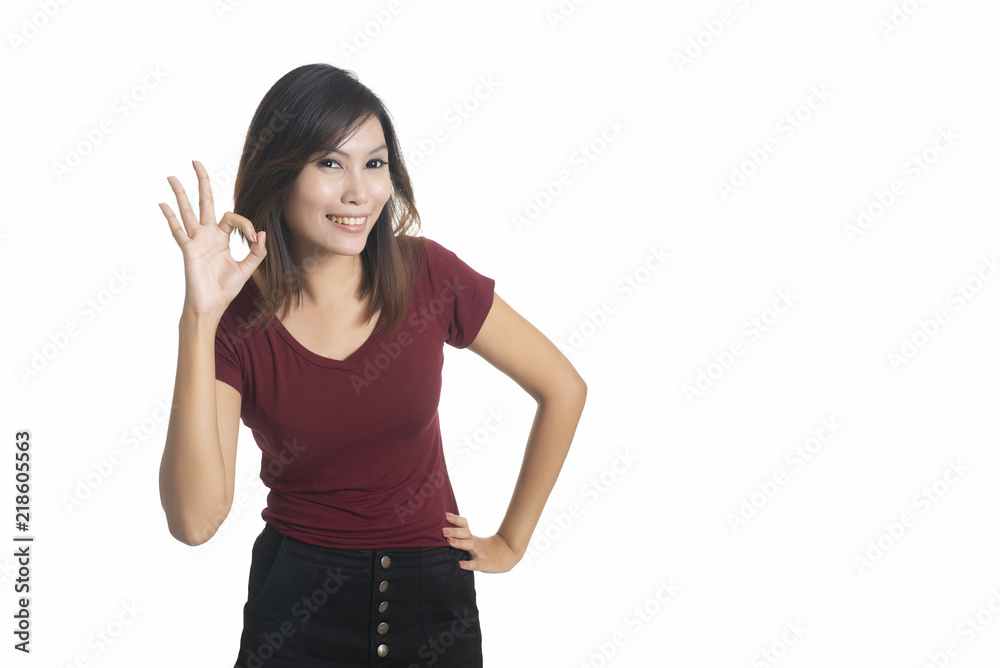 Happy young businesswoman showing ok sign isolated on a white background Happy young businesswoman showing ok sign isolated on a white background