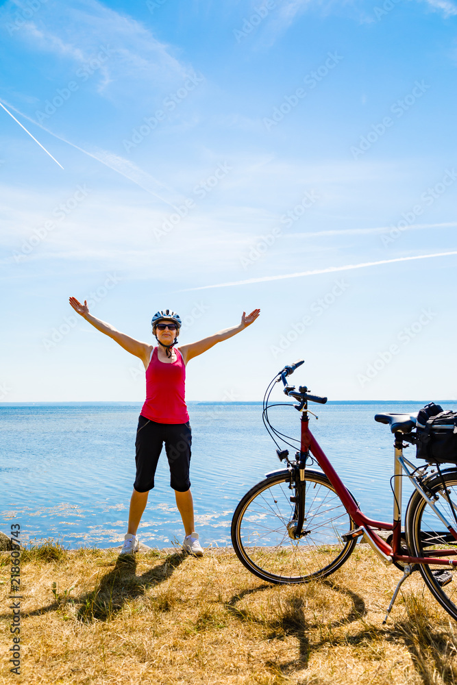 Healthy lifestyle - middle-aged woman riding bicycles Healthy lifestyle - middle-aged woman riding bicycles