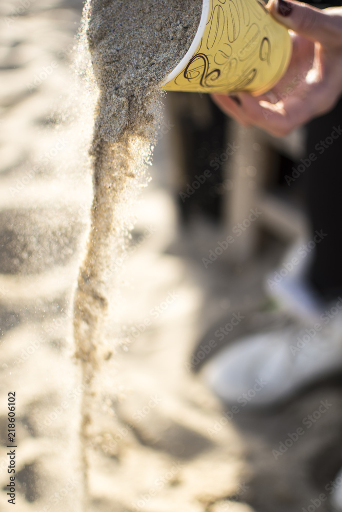 Concept with sand and paper cup on the beach. Concept with sand and paper cup on the beach.