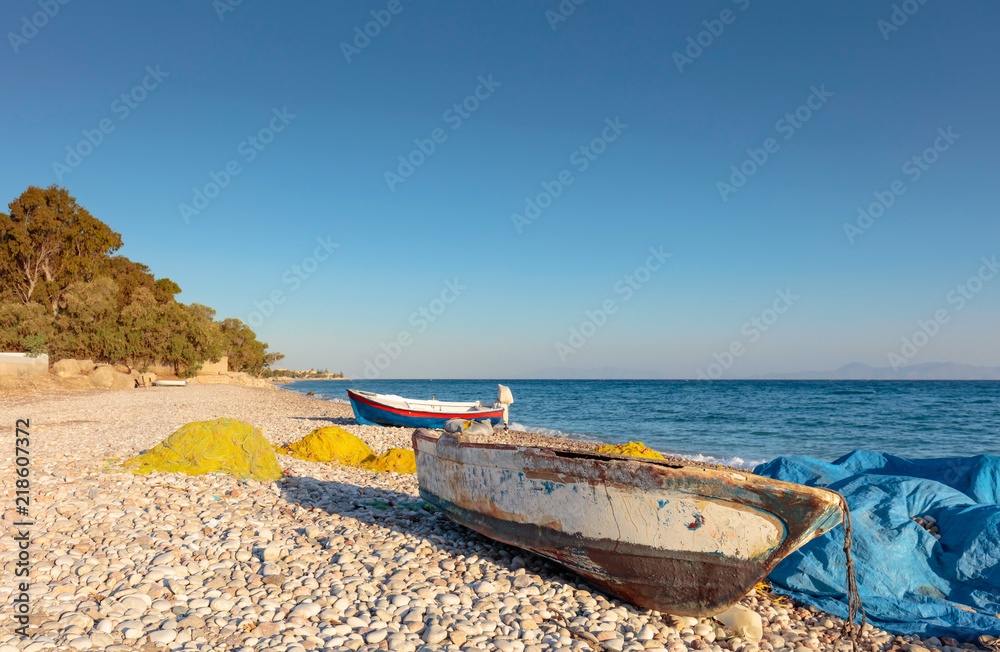 Old fishing boats on a beach of the Mediterranean Sea. Old fishing boats on a beach of the Mediterranean Sea.