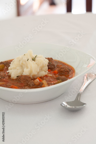 Stew in bowl on table