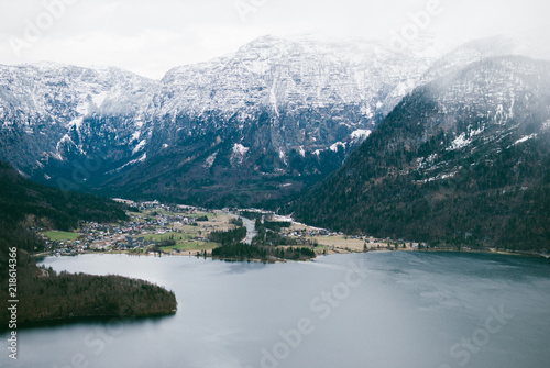 Breathtaking landscape view from the Hallstatt skywalk. Mountain dark blue lake and peaks covered with snow. Alps in Austria.