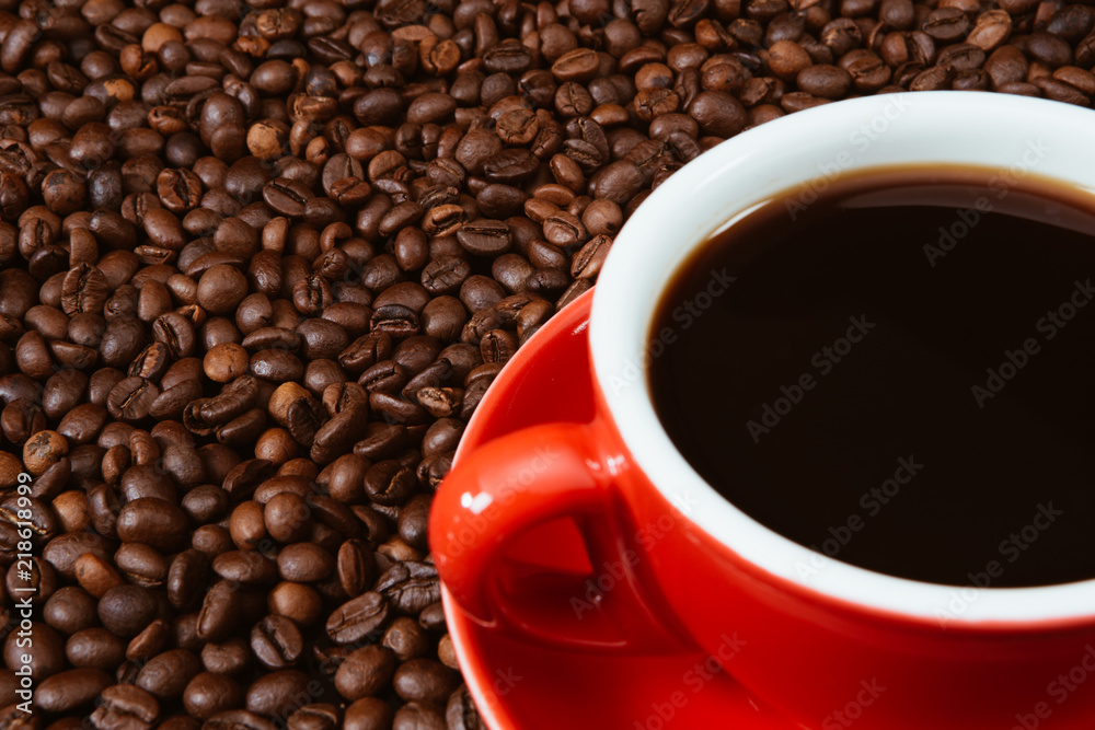 Red coffee cup with coffee beans . Red coffee cup with coffee beans .