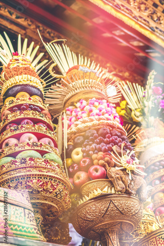 Traditional balinese offerings to Gods with fruits in basket.