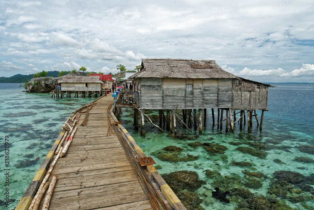View of traditional bajo village with bridge and wooden houses on the Togean islands in Central Sulawesi, Indonesia