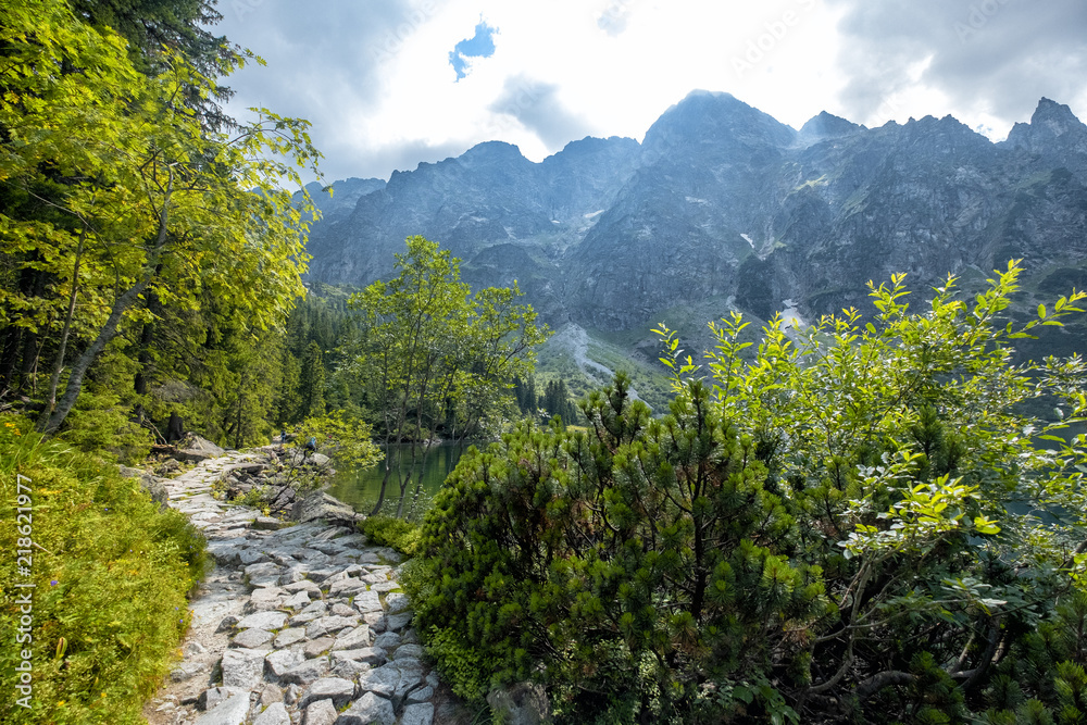 Mountain landscape with hiking trail and view of beautiful lakes Mountain landscape with hiking trail and view of beautiful lakes