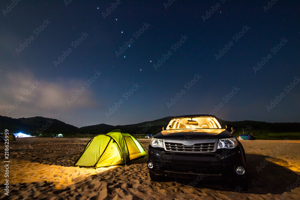 Camping at the sandy beach under stars