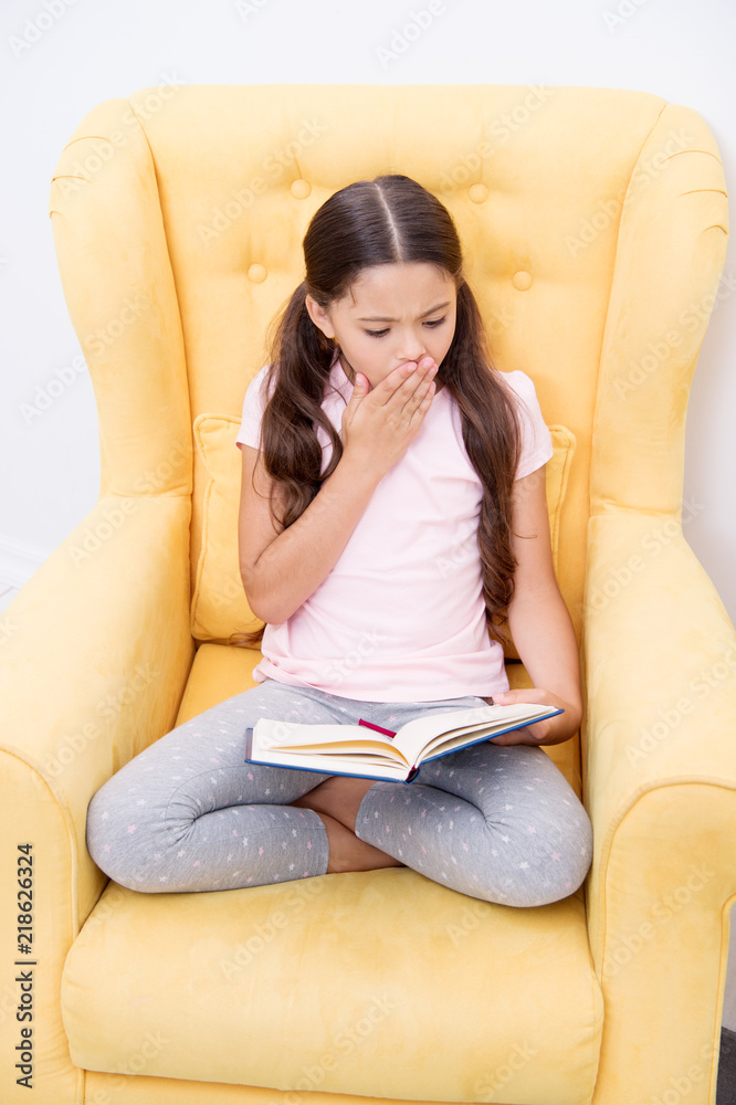 Enthusiastic about exciting story. Reading hobby. Girl child sit yellow armchair read book. Kid cute bookworm. Girl kid cute pajamas relax read fairytale book before sleep. Encourage useful habits Enthusiastic about exciting story. Reading hobby. Girl child sit yellow armchair read book. Kid cute bookworm. Girl kid cute pajamas relax read fairytale book before sleep. Encourage useful habits