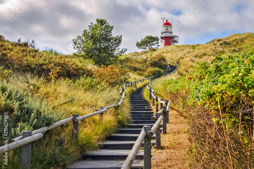 Stairs towards the lighthouse of the Frisian Island of Vlieland. The Frisian Islands, also known as the Wadden Islands or Wadden Sea Islands, form an archipelago at the eastern edge of the North Sea photo